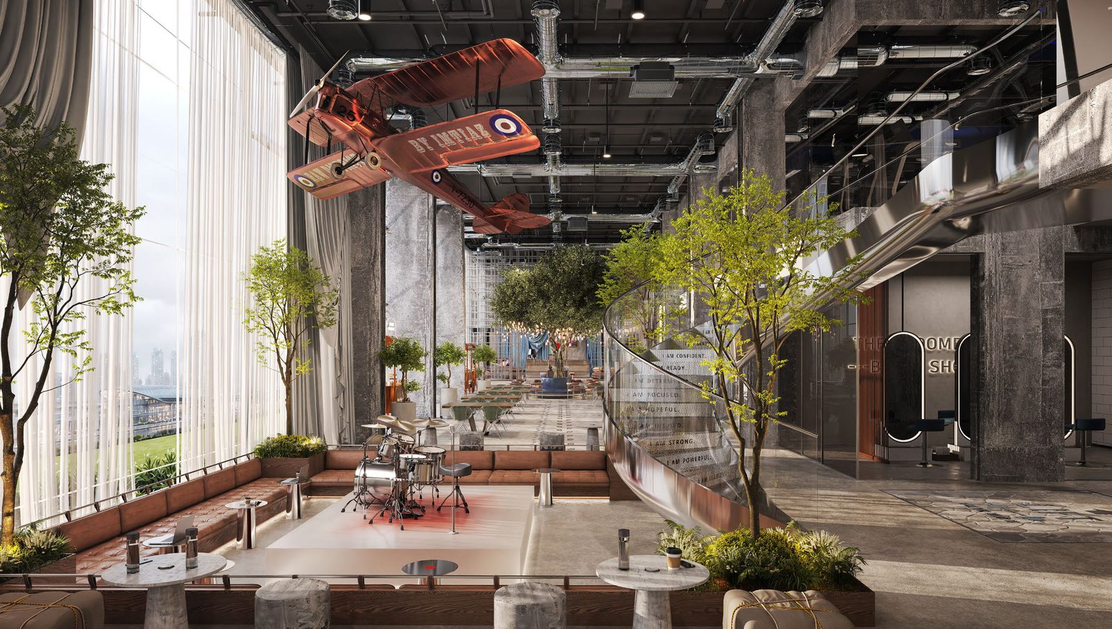 RAW District double-height social lobby with greenery and creative communal spaces